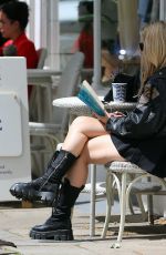 LOTTIE MOSS Out Reading The Unexpected Joy of Being Sober by Catherine Gray in London 07/17/2023