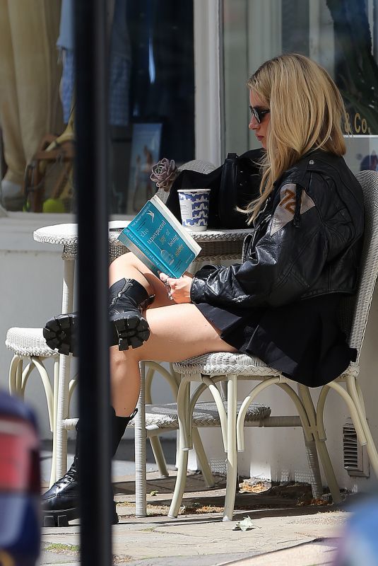 LOTTIE MOSS Out Reading The Unexpected Joy of Being Sober by Catherine Gray in London 07/17/2023