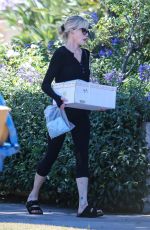 MELANIE GRIFFITH Arrives at a Friend