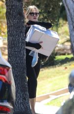 MELANIE GRIFFITH Arrives at a Friend