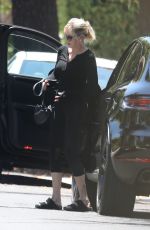 MELANIE GRIFFITH Arrives at a Friend