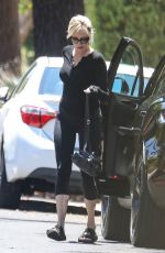 MELANIE GRIFFITH Arrives at a Friend