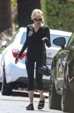 MELANIE GRIFFITH Arrives at a Friend