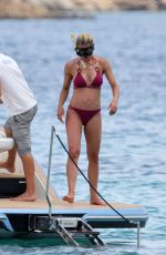 MICHELLE HUNZIKER and AURORA RAMAZZOTTI in Biknis at a Boat at La Maddalena 07/23/2023