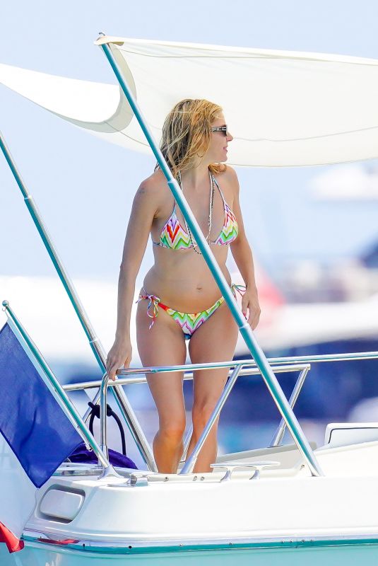 SIENNA MILLER in Bikini at a Boat in St Tropez 07/18/2023