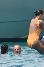 ZOE SALDANA in Swimsuit at a Yacht in Sardinia 07/23/2023