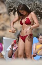 AMBER WISE in a Red Bikini at a Beach in Faro 08/25/2023
