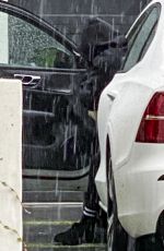 ARIANA MADIX Braves the Storm as She Arrives at Her Home in Los Angeles 08/20/2023
