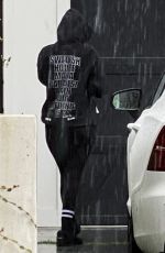 ARIANA MADIX Braves the Storm as She Arrives at Her Home in Los Angeles 08/20/2023