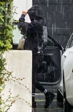 ARIANA MADIX Braves the Storm as She Arrives at Her Home in Los Angeles 08/20/2023