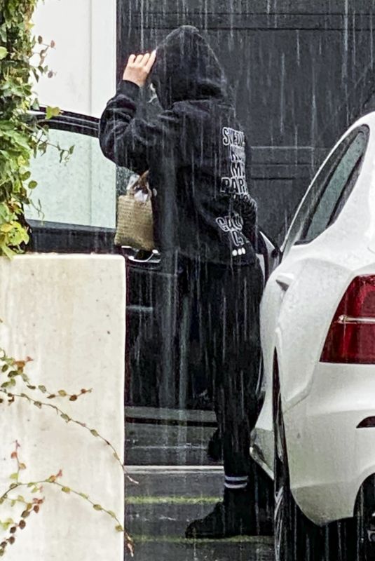 ARIANA MADIX Braves the Storm as She Arrives at Her Home in Los Angeles 08/20/2023