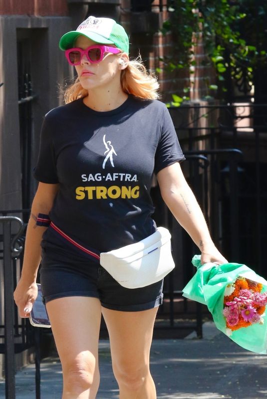 BUSY PHILIPPS in a SAG-AFTRA Strike T-Shirt and Hat Out in New York 08/09/2023