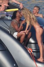 CANDICE SWANEPOEL, DOUTZEN KROES and JOAN SMALLS in Bikinis on Holiday on Mykonos Islands 08/21/2023