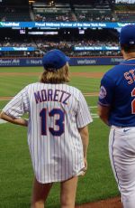 CHLOE MORETZ Throws Out First Pitch at Chicago Cubs vs. New York Mets Game in New York 08/07/2023