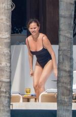 CHRISSY TEIGEN in Swimsuit a a Pool in Puerto Vallarta 08/07/2023