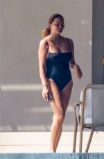 CHRISSY TEIGEN in Swimsuit a a Pool in Puerto Vallarta 08/07/2023