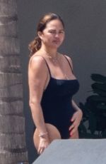 CHRISSY TEIGEN in Swimsuit a a Pool in Puerto Vallarta 08/07/2023