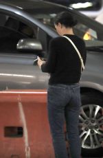 CHRISTINA RICCI Takes a Cigarette Break at LAX 08/07/2023