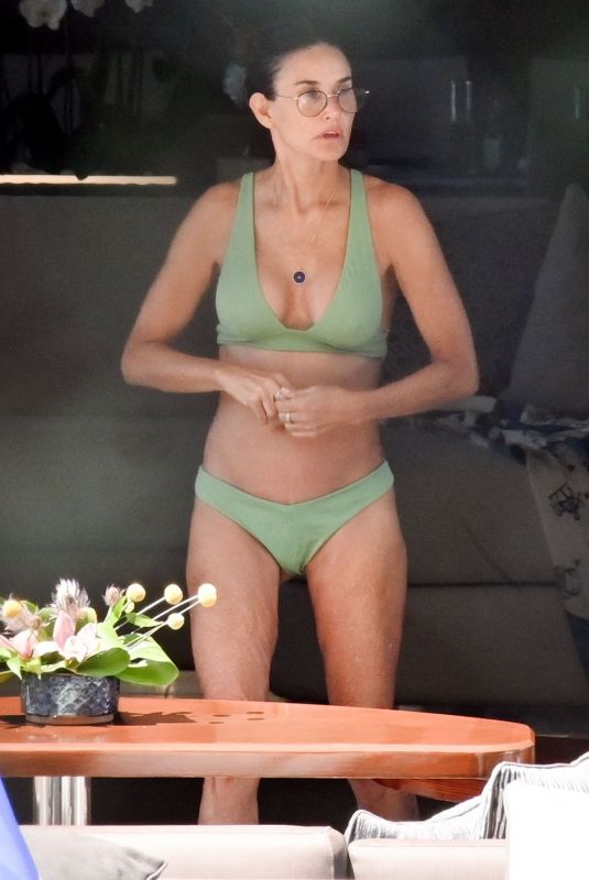 DEMI MOORE in a Green Bikini at a Boat in Greek 08/13/2023