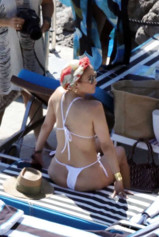 JENNIFER LOPEZ in a White Bikini at a Photoshoot in Italy 08/10/2023