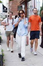 KATIE HOLMES Chats on Her Phone Out in New York 08/09/2023