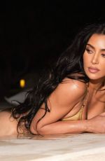 KIM KARDASHIAN in a Golden Bikini at a Photoshoot 08/14/2023