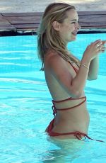 KIMBERLEY GARNER in Bikini at a Pool in Capri 08/17/2023