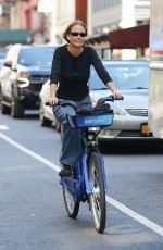 LARA WORTHINGTON Out on a City Bike in New York 08/18/2023