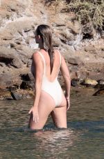 MARGOT ROBBIE in a White Swimsuit at at a Beach in Greece 08/27/2023