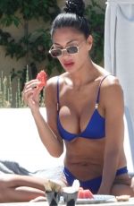 NICOLE SHERZINGER in a Blue Bikini at a Beach in Sardinia 08/10/2023