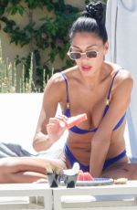 NICOLE SHERZINGER in a Blue Bikini at a Beach in Sardinia 08/10/2023