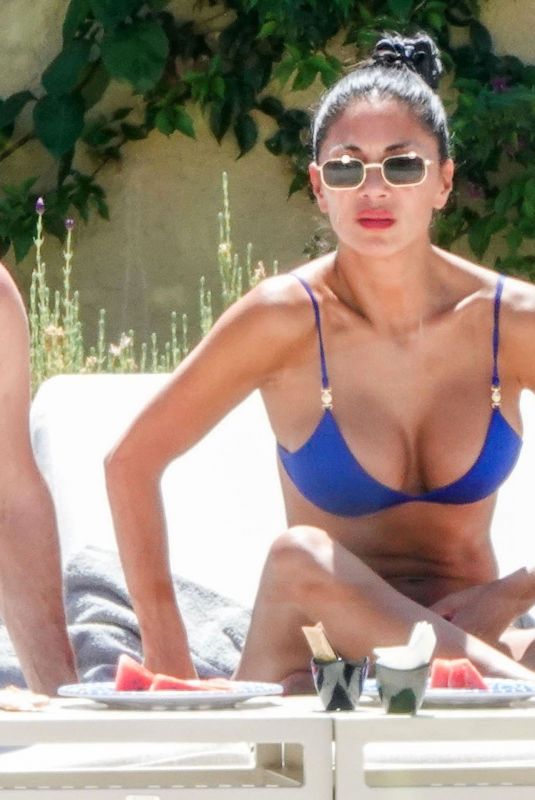 NICOLE SHERZINGER in a Blue Bikini at a Beach in Sardinia 08/10/2023