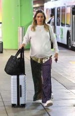 Pregnant CLAIRE HOLT Arrives at LAX Airport 08/21/2023