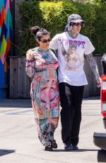 Pregnant KOURTNEY KARDASHIAN and Travis Barker Cruise in Their Barbie-inspired Classic SUV in Calabasas 08/06/2023