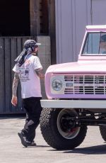 Pregnant KOURTNEY KARDASHIAN and Travis Barker Cruise in Their Barbie-inspired Classic SUV in Calabasas 08/06/2023