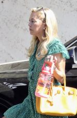 SUTTON STRACKE Headed to Her Fashion Boutique Office 08/01/2023
