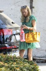 SUTTON STRACKE Headed to Her Fashion Boutique Office 08/01/2023
