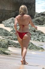 ALICE EVE in a Red Bikini at a Beach in Barbados 09/06/2023
