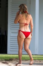 ALICE EVE in a Red Bikini at a Beach in Barbados 09/06/2023