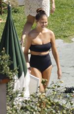 CHRISSY TEIGEN in Swimsuit at a Swimming Pool in Lake Como 09/14/2023