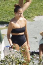 CHRISSY TEIGEN in Swimsuit at a Swimming Pool in Lake Como 09/14/2023