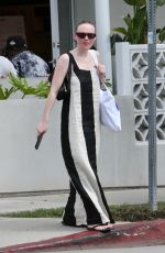 DAKOTA FANNING in a Bold Stripe Dress Out Shopping on Melrose in West Hollywood 09/18/2023
