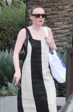 DAKOTA FANNING in a Bold Stripe Dress Out Shopping on Melrose in West Hollywood 09/18/2023