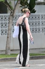 DAKOTA FANNING in a Bold Stripe Dress Out Shopping on Melrose in West Hollywood 09/18/2023