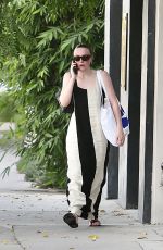 DAKOTA FANNING in a Bold Stripe Dress Out Shopping on Melrose in West Hollywood 09/18/2023