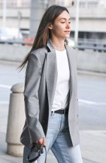 EMMY ROSSUM Out with her Dog at JFK Airport in New York 09/06/2023
