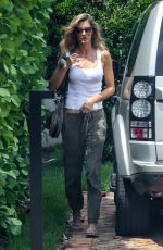 GISELE BUNDCHEN Brings Her German Shepherd to Her New Home in Miami 08/01/2023