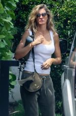 GISELE BUNDCHEN Brings Her German Shepherd to Her New Home in Miami 08/01/2023