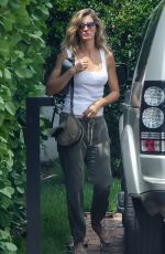 GISELE BUNDCHEN Brings Her German Shepherd to Her New Home in Miami 08/01/2023