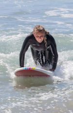 JOJO SIWA in Wetsuit Out Surfing with Her Dad in Malibu 09/07/2023